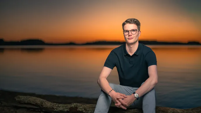 LUT student on the beach of the lake Saimaa.