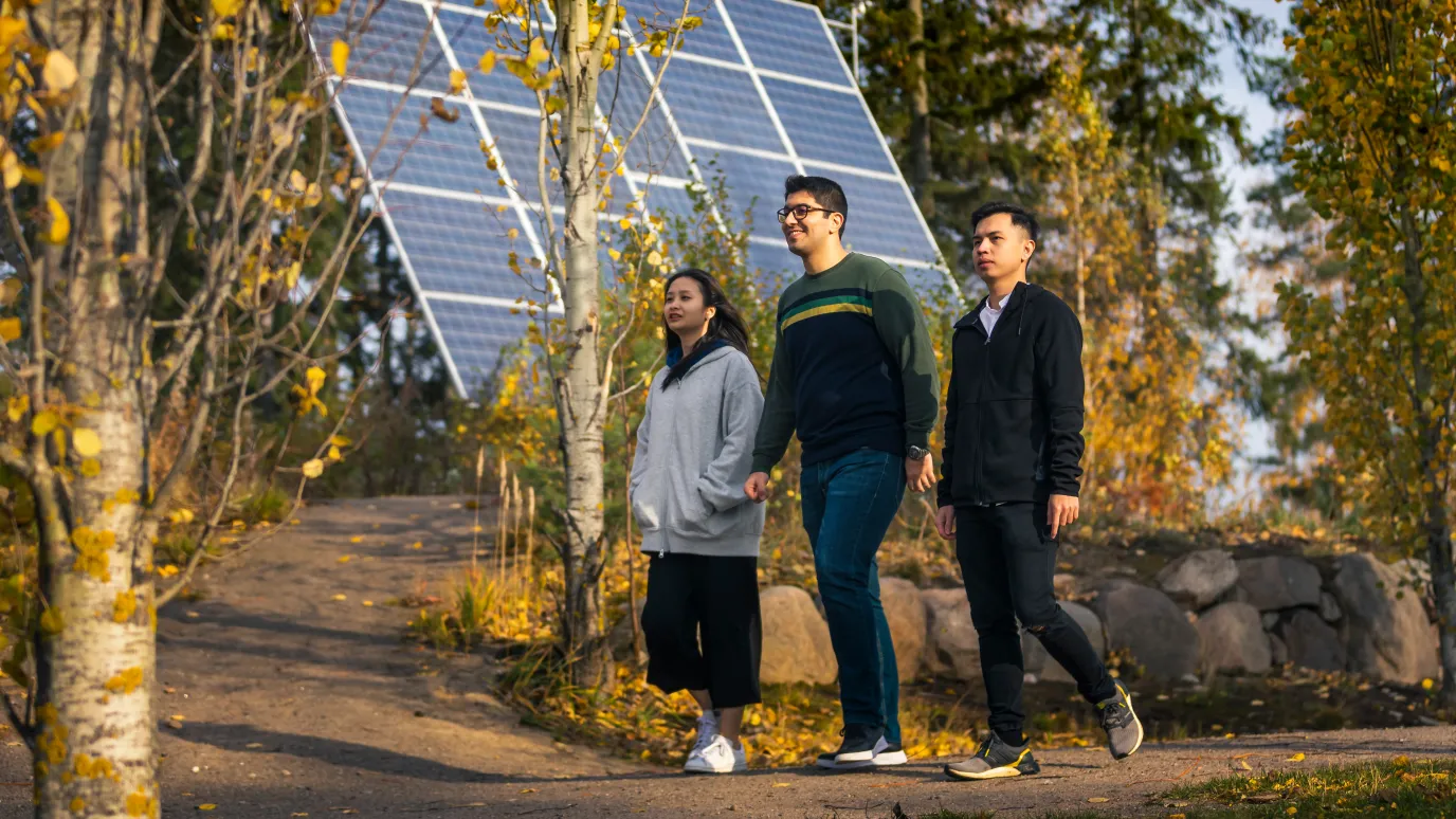 International students walking in park at LUT University campus