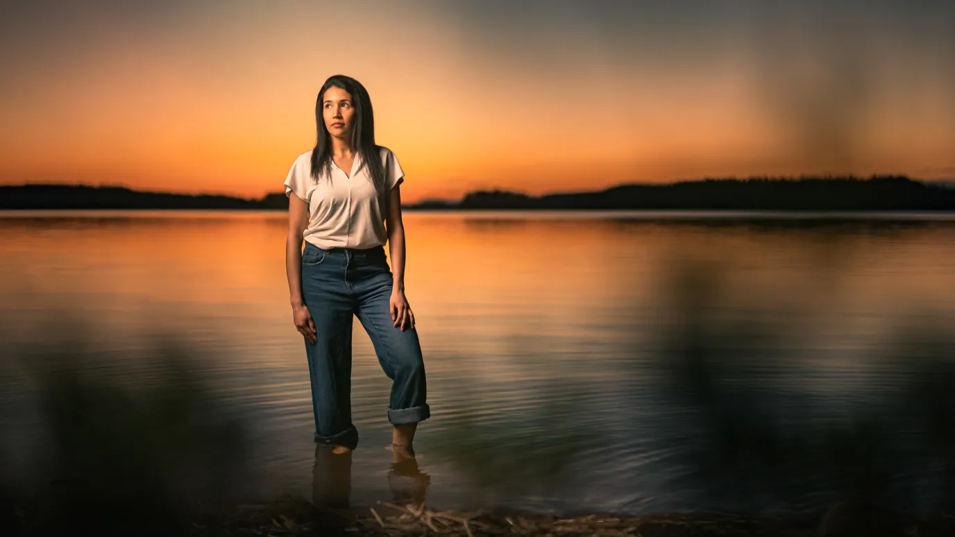 LUT student on the beach of the lake Saimaa