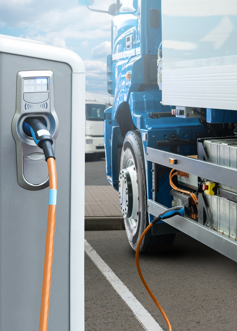 LUT University researches electrification of heavy duty transport and electric transportation in general. In the photo (iStock), there is a electric truck charging. 